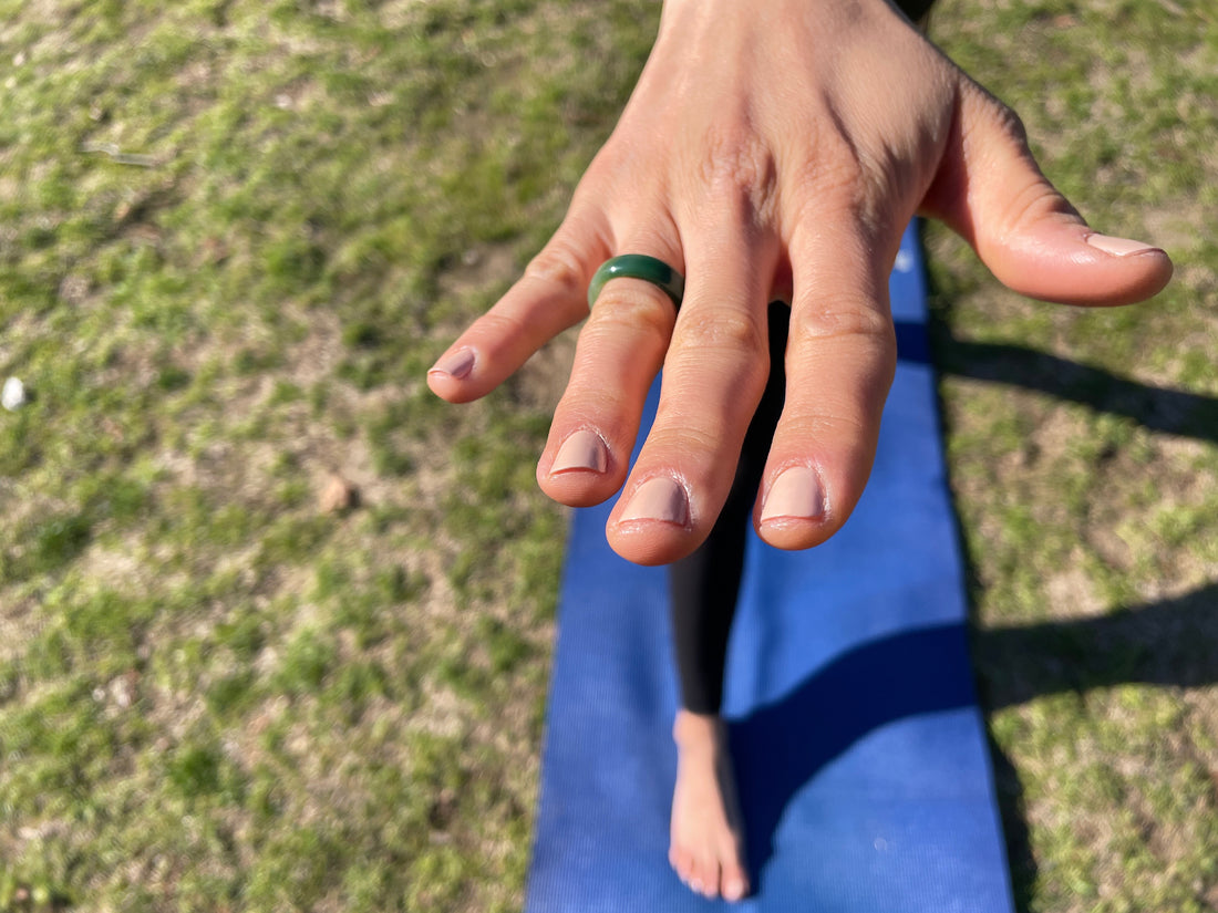 womans hand wearing the green agate chakra ring from whitestone jewelry co.
