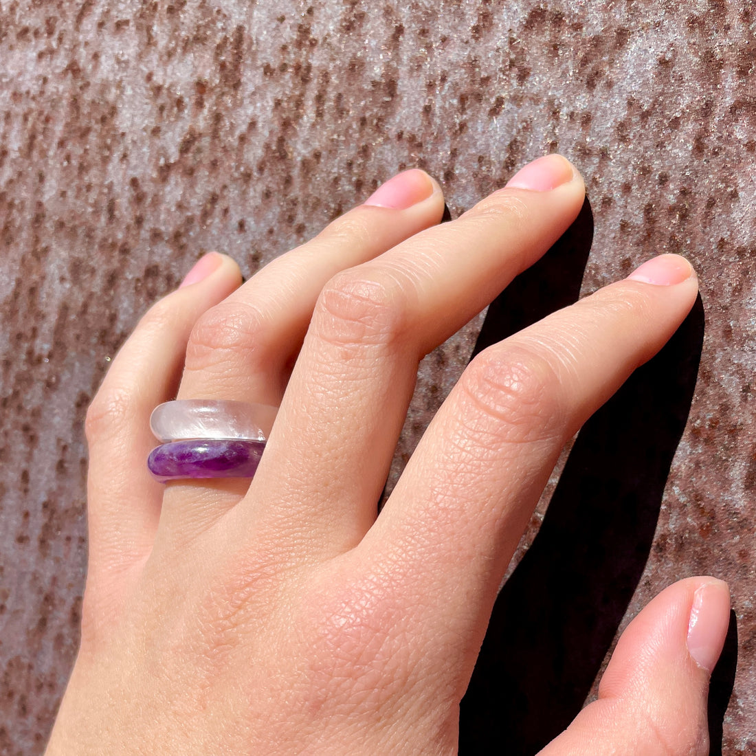 caruba white quartz stone band ring from whitestone jewelry co worn with amethyst ring by woman