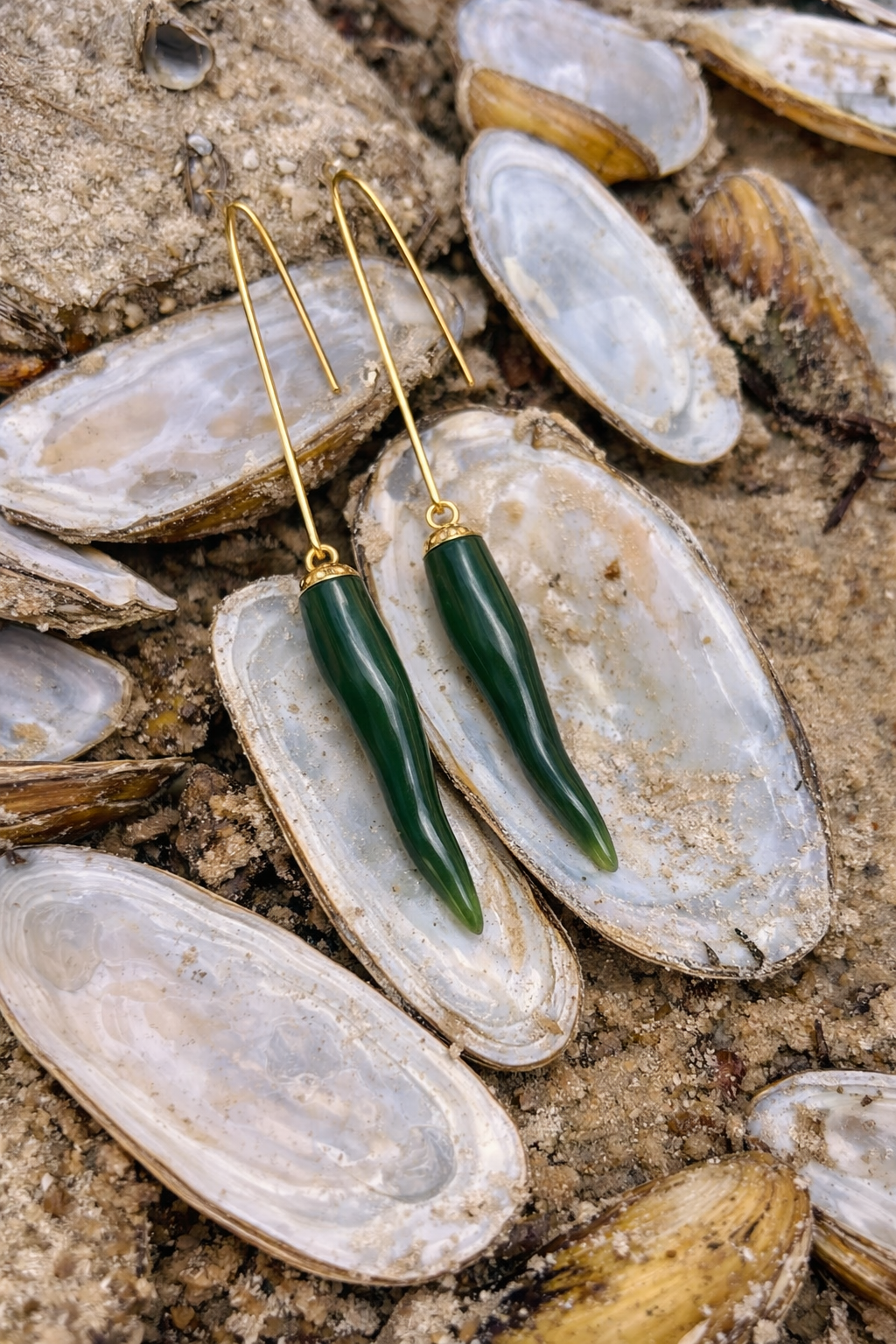 Green jade and gold repurposed vintage earrings on open mussel shells