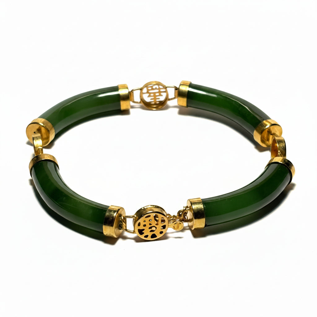 Green bracelet with gold accents on a white background