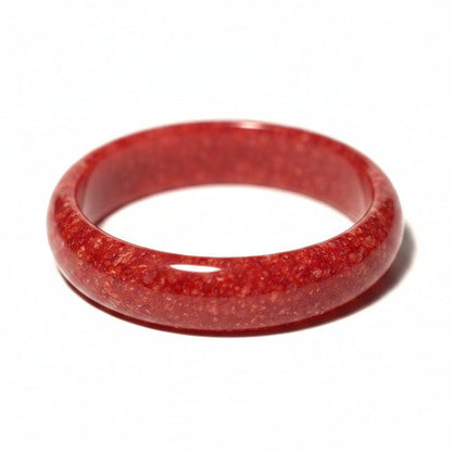 chicken blood red jade bangle on a white background