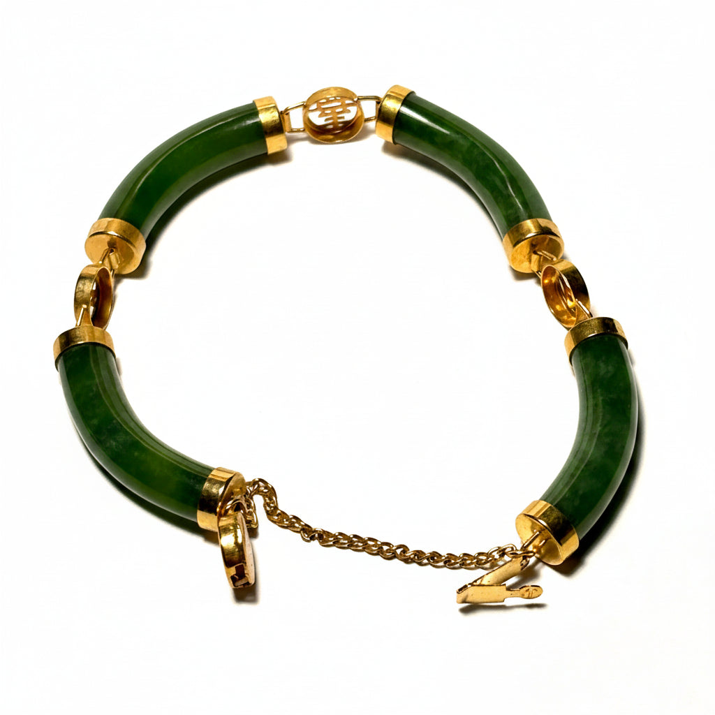 Green bracelet with gold accents on a white background