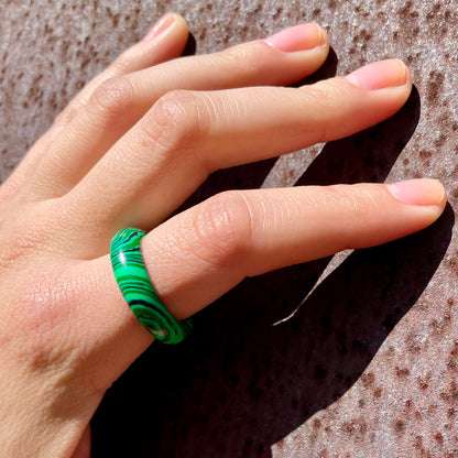 whitestone jewelry co. malachite stone band ring worn by woman