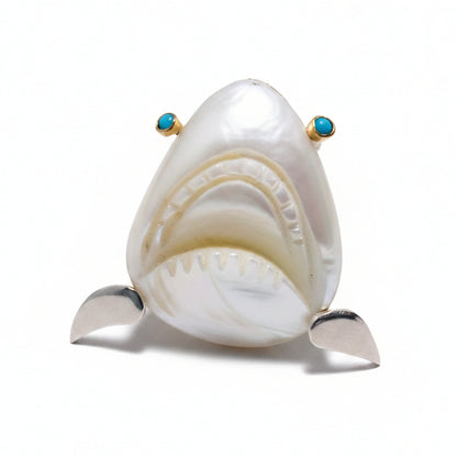 mother of pearl shark head ring with turquoise eyes and sterling silver band and setting with 18K gold eye settings